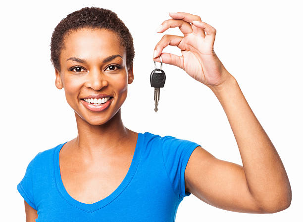 istockphoto-171348534-612x612 Portrait of a beautiful African American woman holding car key. Horizontal shot. Isolated on white.